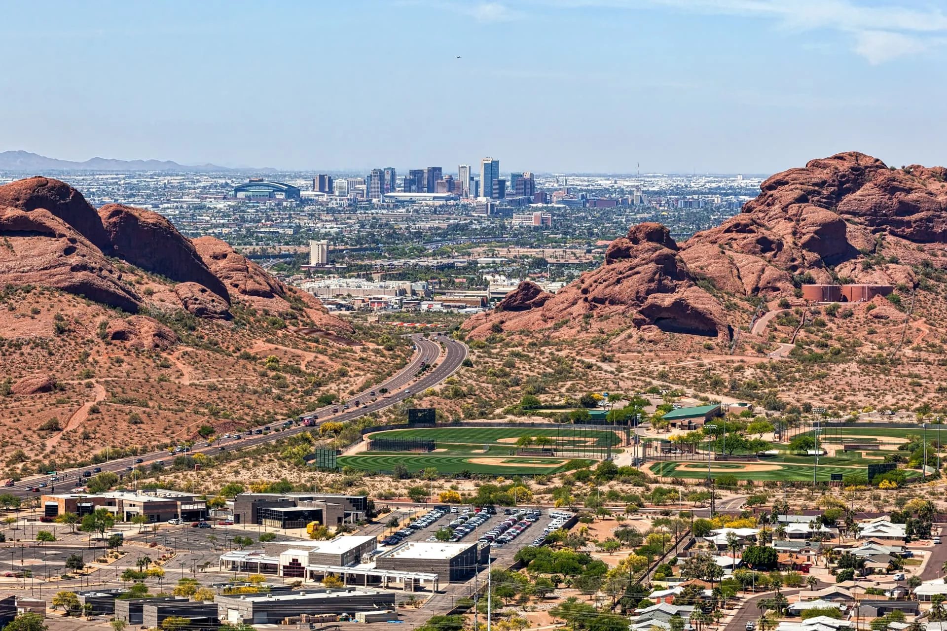 Desert hills with the Phoenix, Arizona skyline beyond