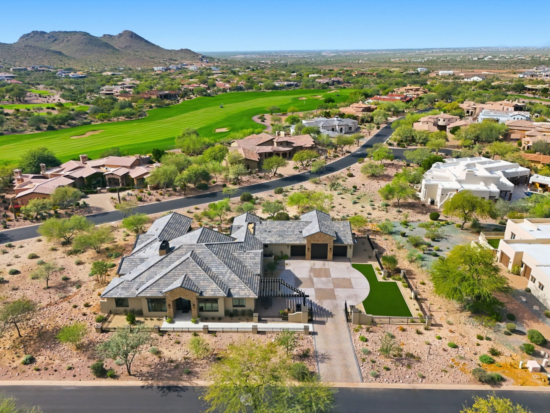 Aerial view of Gold Canyon, Arizona homes and golf course with desert mountains