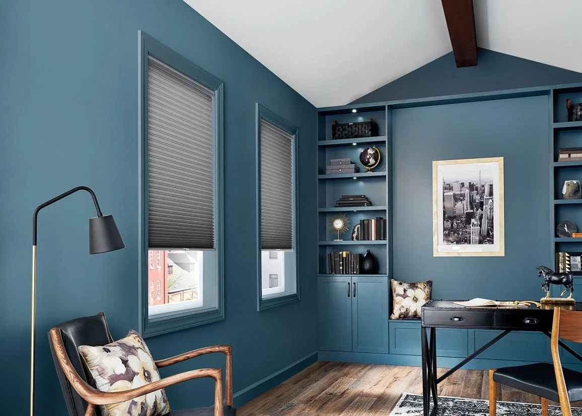Cellular shades in a blue home office