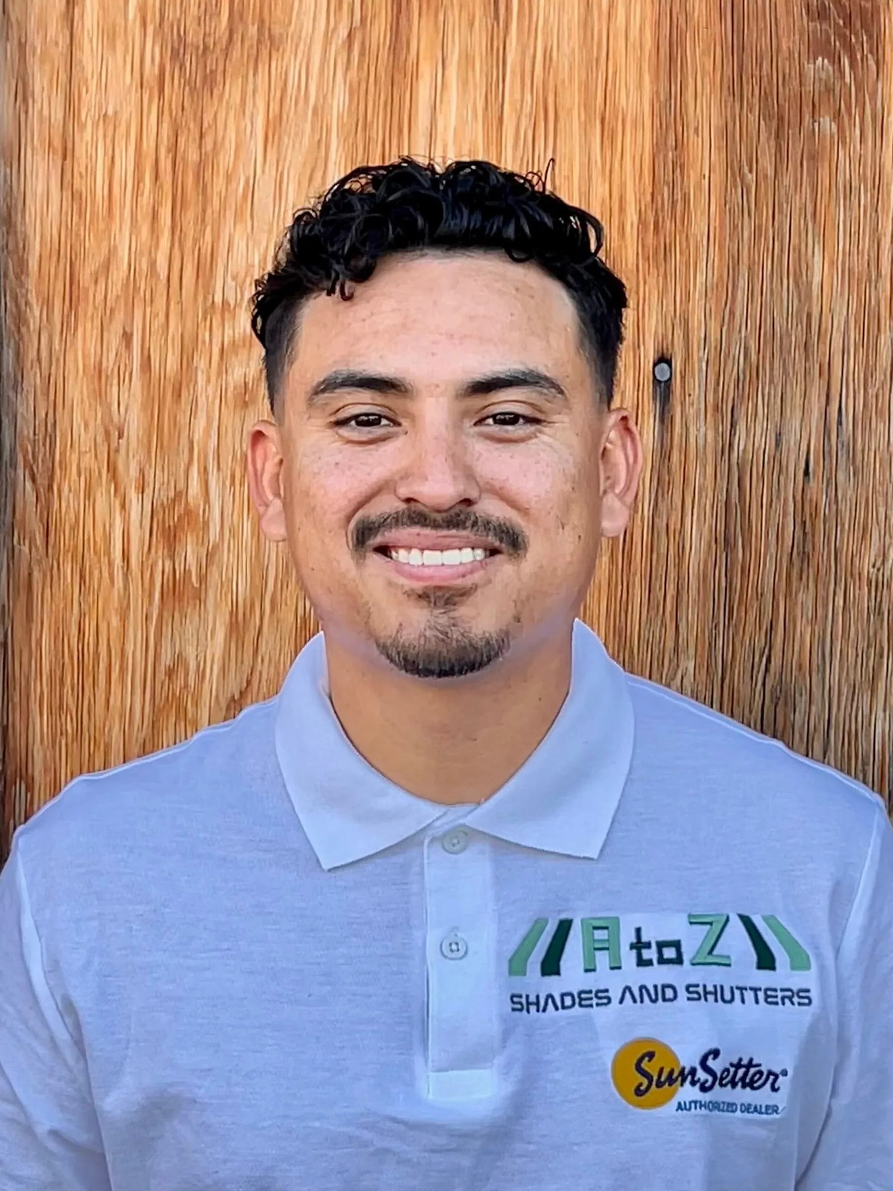 Fernando Fernandez, owner of A to Z Shades and Shutters, in a branded polo shirt