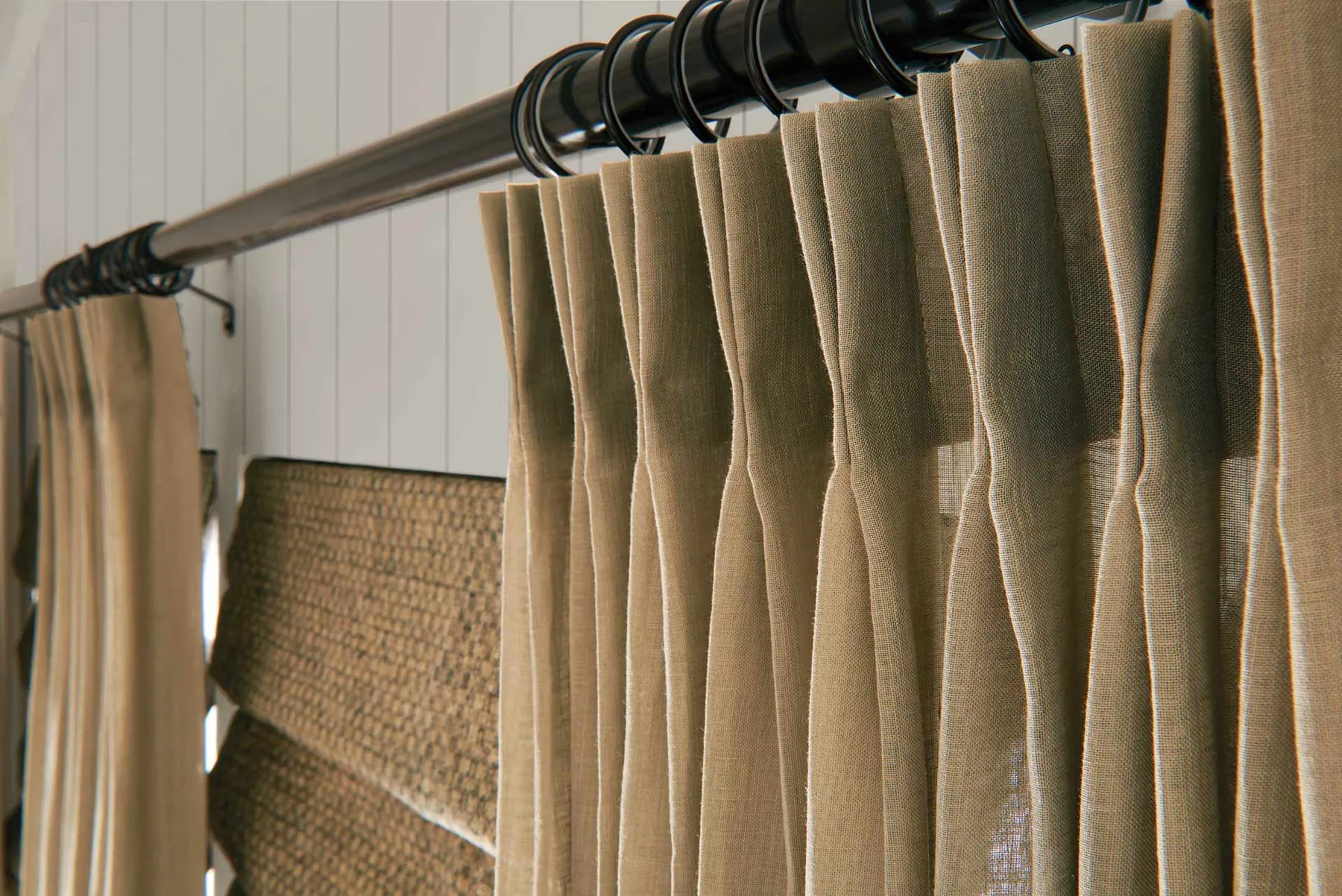 Floor length custom drapery panels framing a window