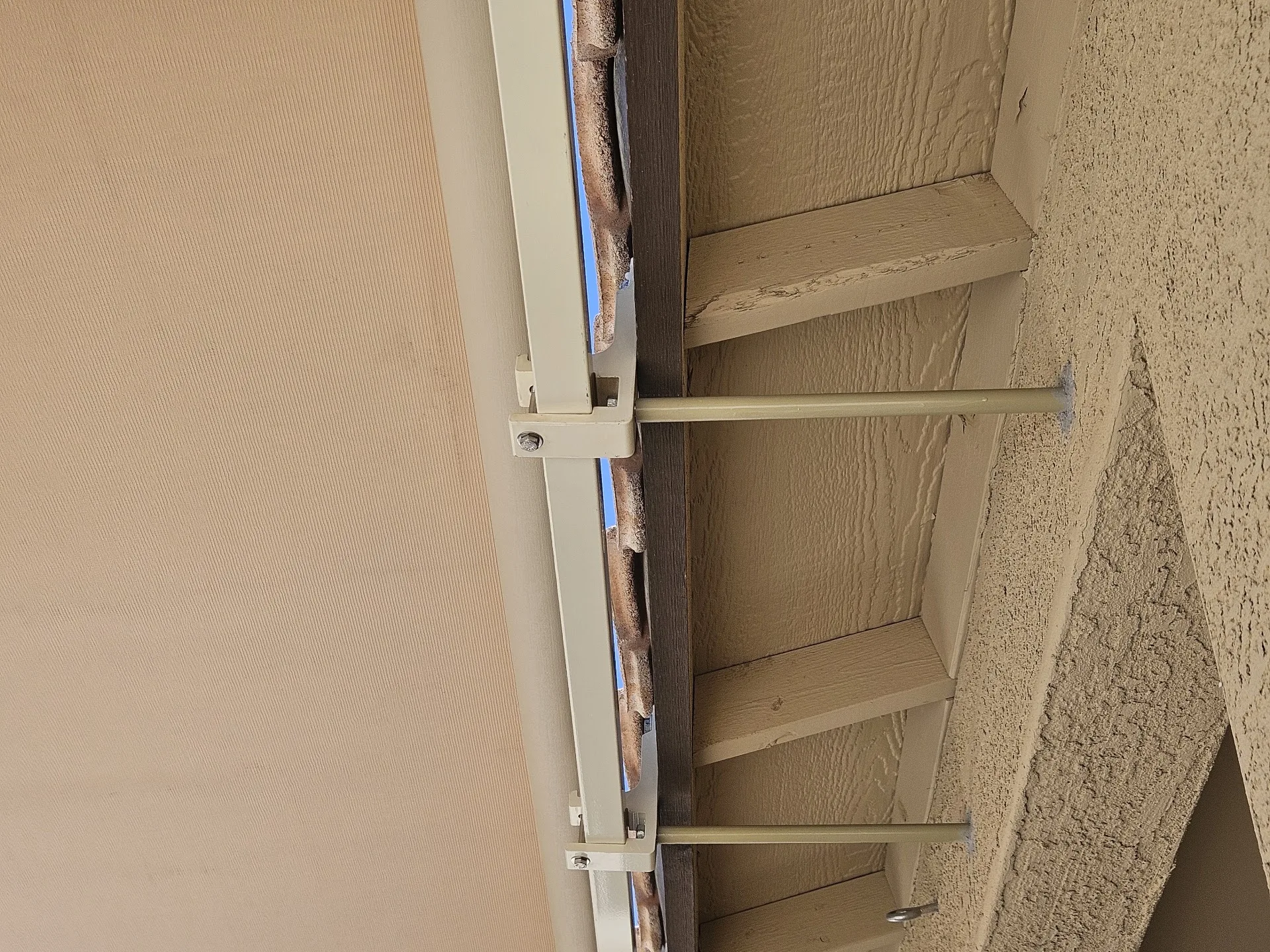 Technician servicing an exterior shade system