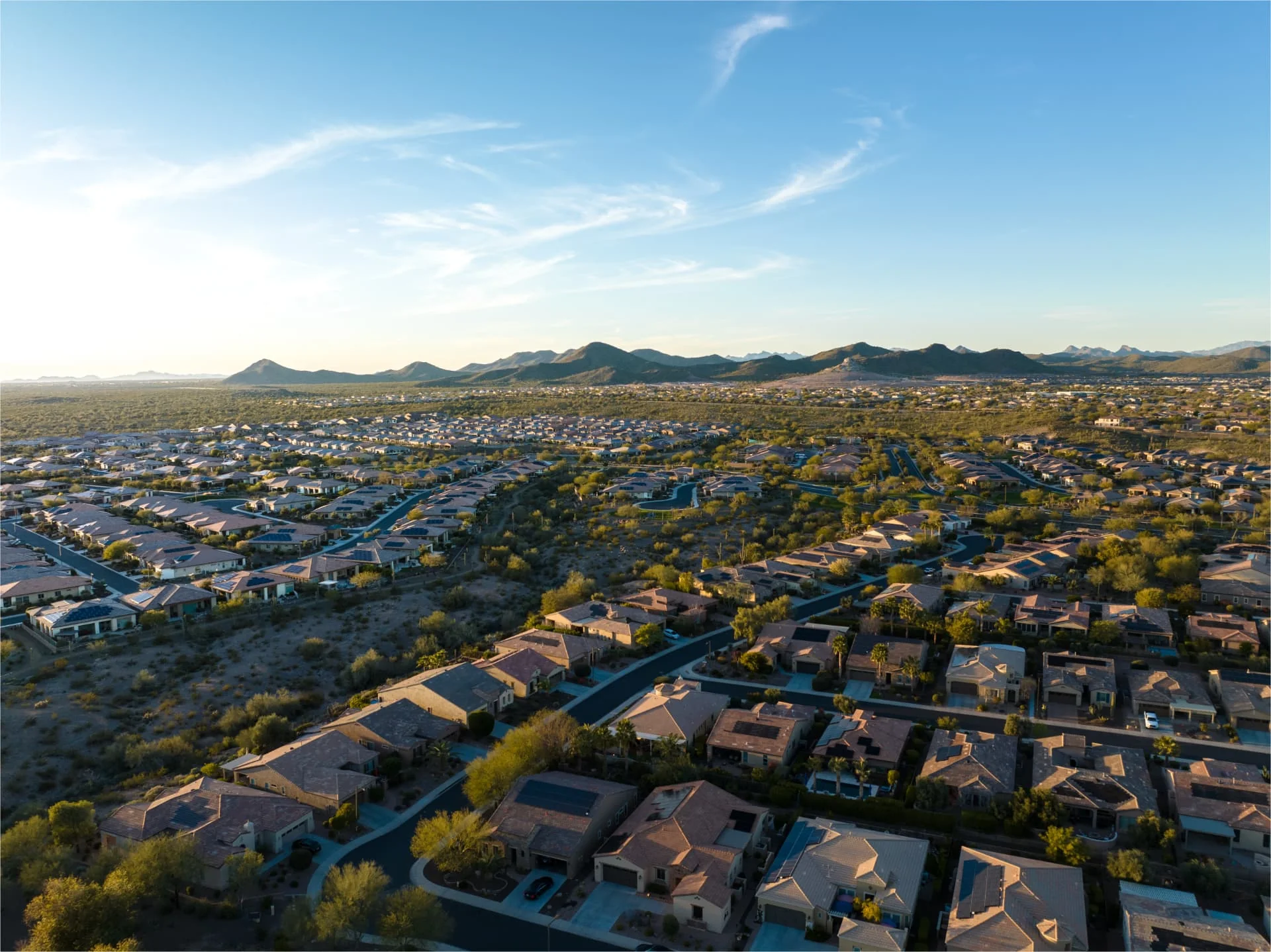Aerial view of Peoria, Arizona neighborhoods with the White Tank Mountains beyond