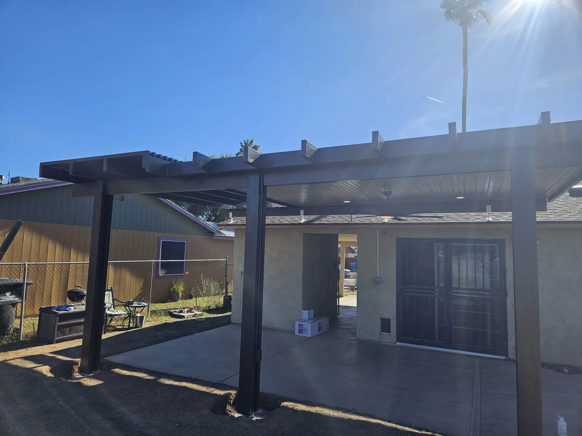 Freestanding shade structure installed over a patio