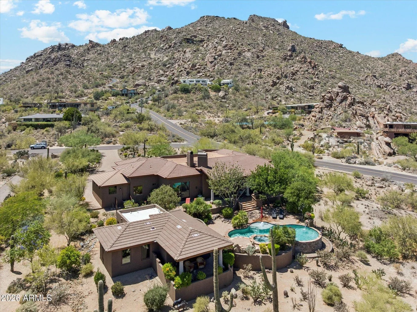 Desert foothills home among boulders in Carefree, Arizona