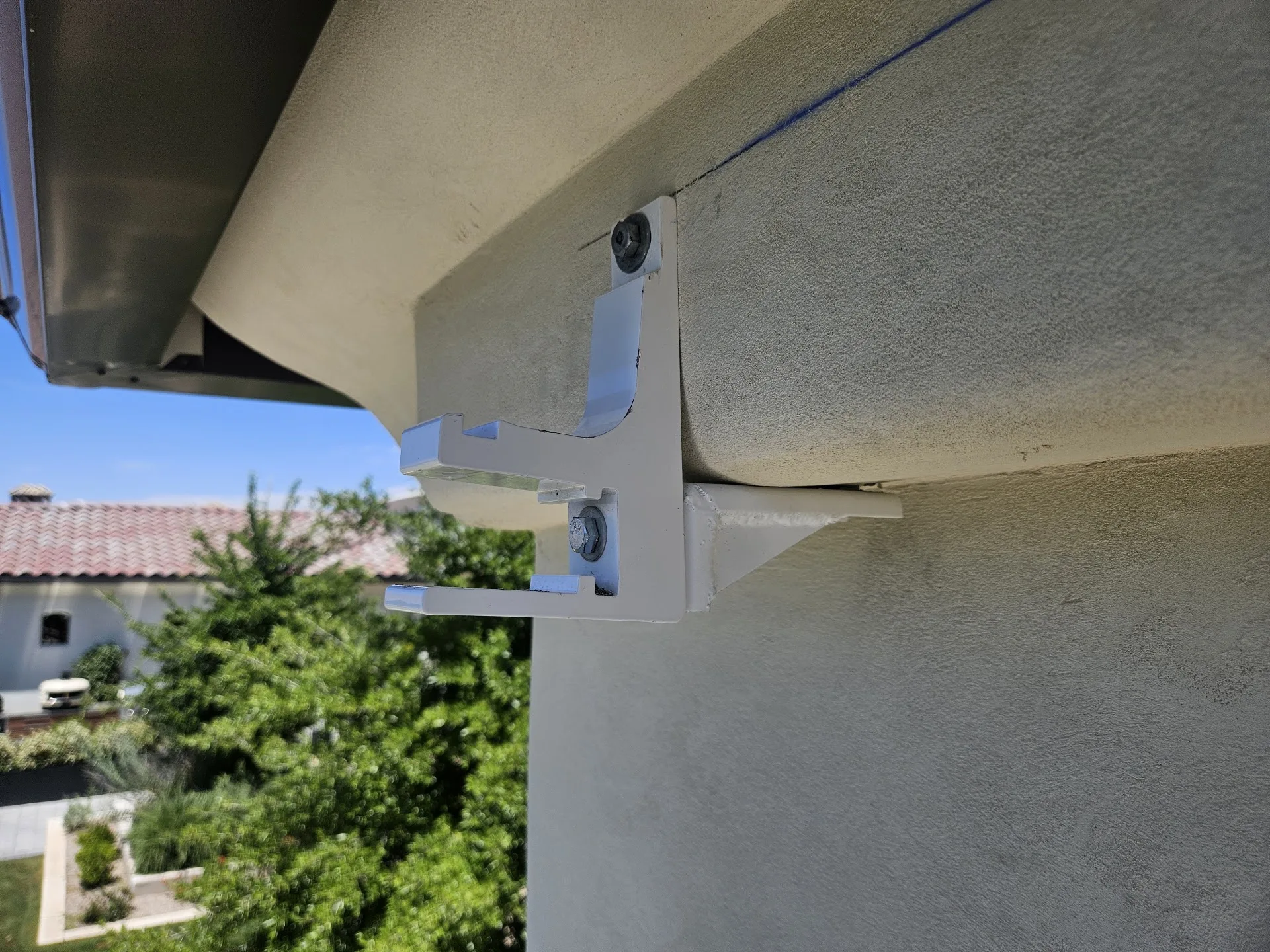 Awning hardware being serviced during a repair visit