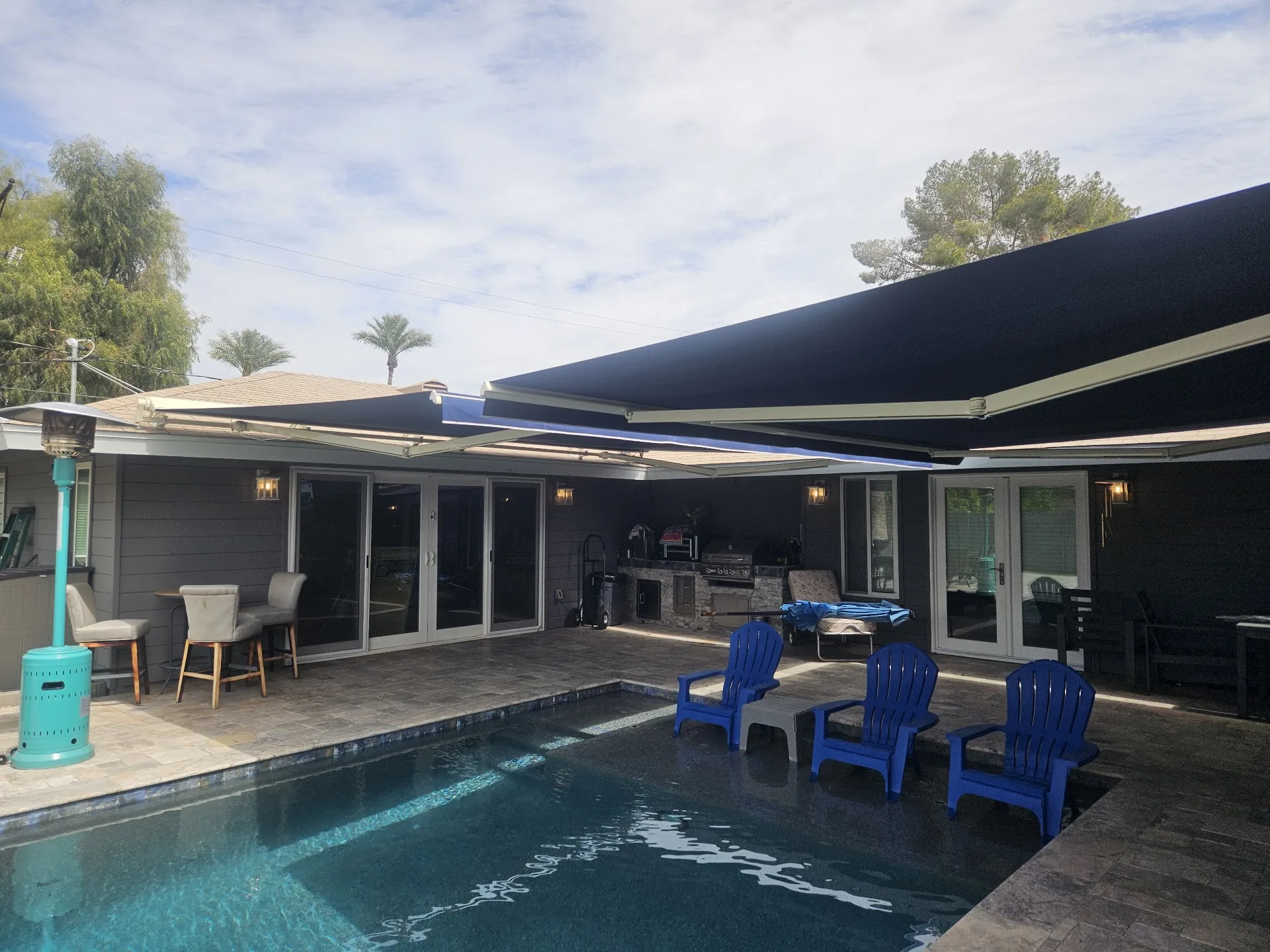 Retractable awning shading an Arizona backyard patio