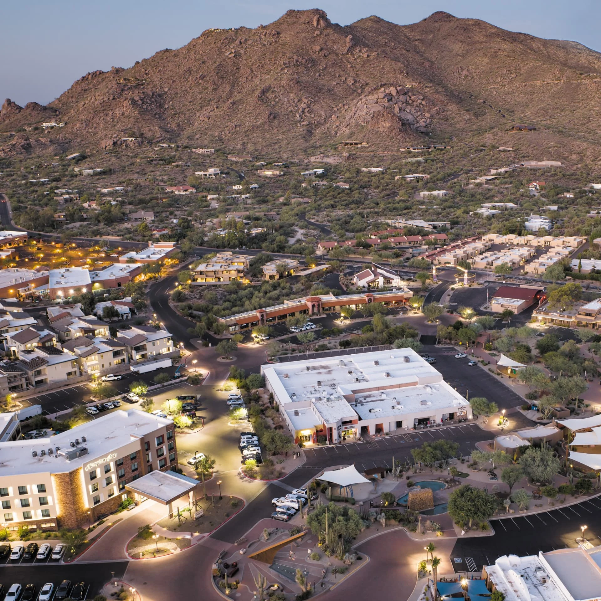 Evening aerial view of the Carefree, Arizona town center below the hills