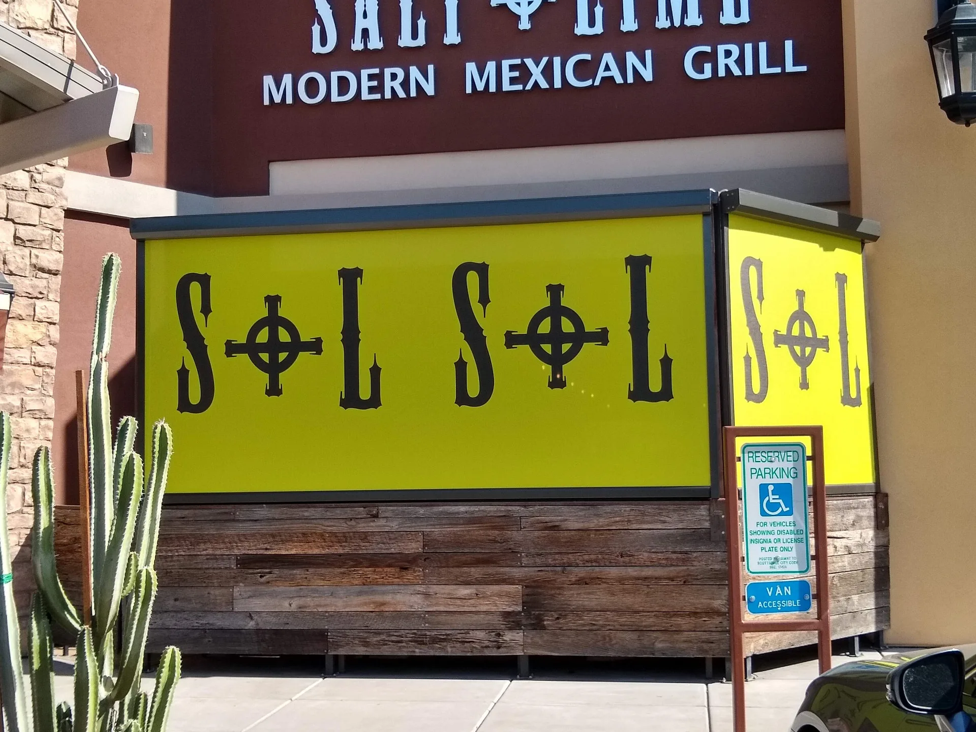 Printed logo shades on a restaurant patio enclosure