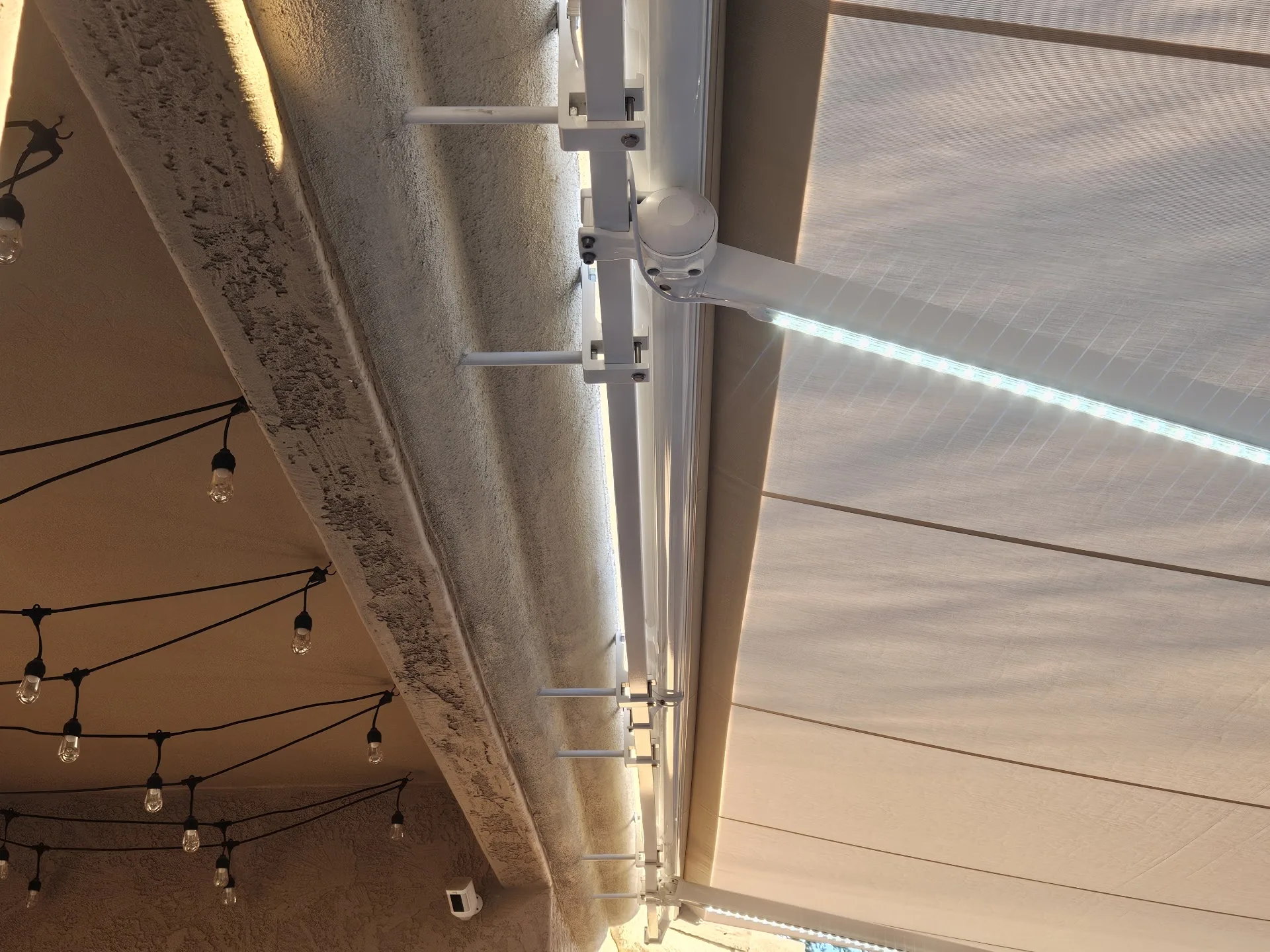 Exterior shade system being repaired on a residential patio