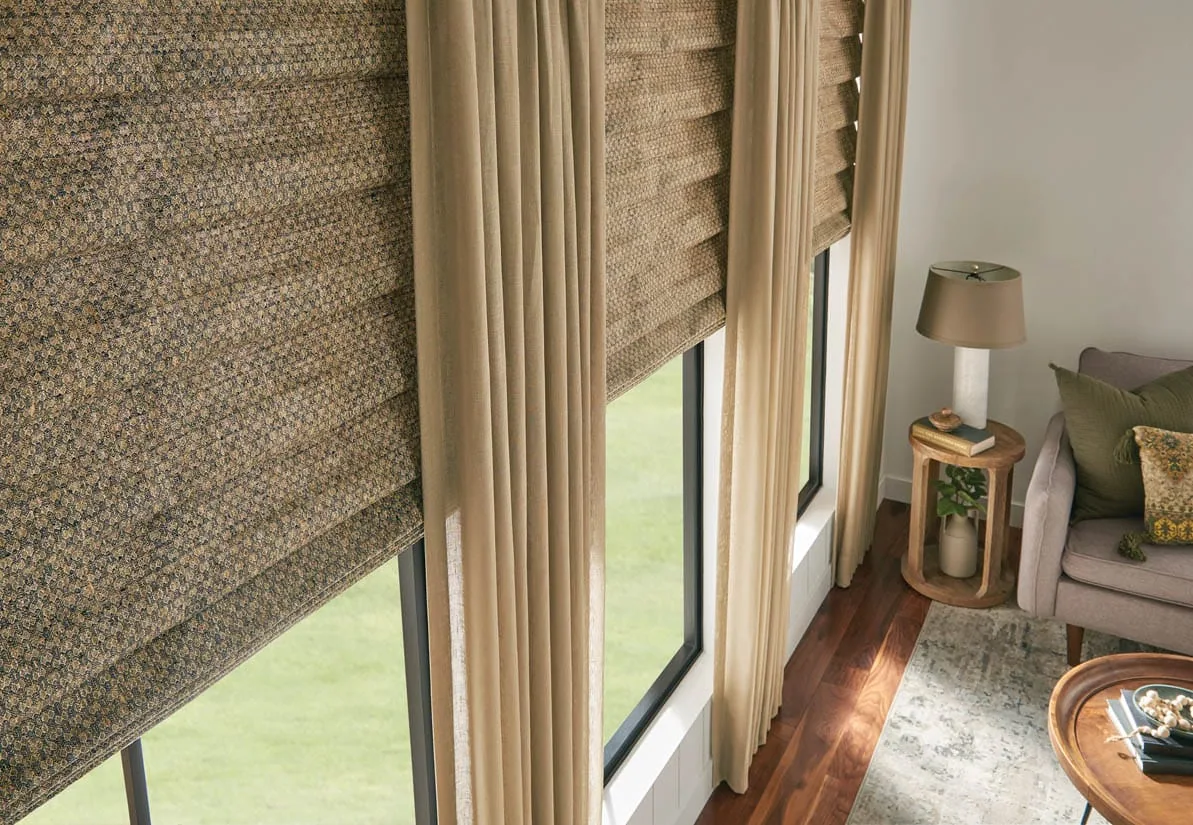 Natural woven shades layered with drapery